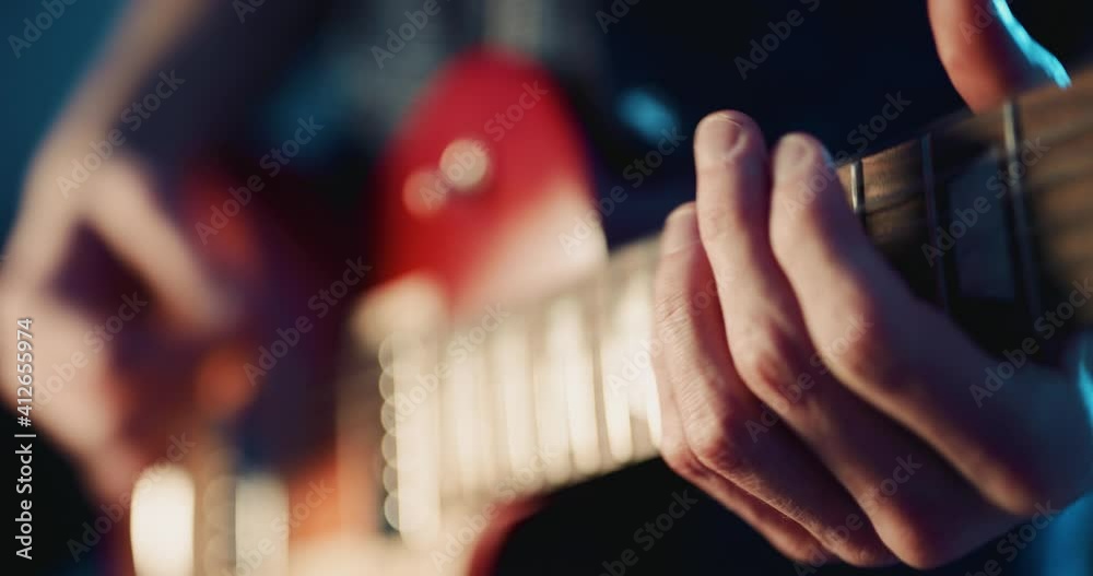 Guitarist playing electric guitar on stage