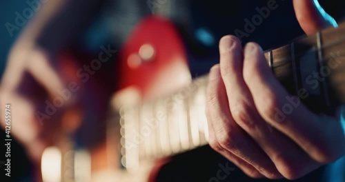 Guitarist playing electric guitar on stage