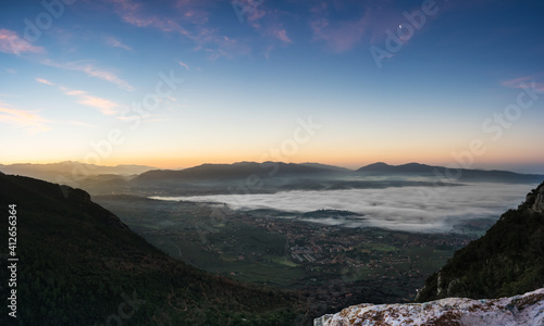 Sunrise from the top of the mountain with fog on the valley  Terni  Umbria  Italy