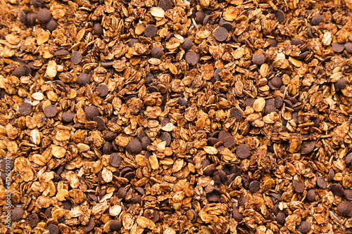 Background of tasty granola with chocolate