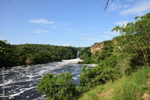 Murchison Falls National Park Uganda, Waterfall in beautiful green forest with white water, rocks, roaring water photo