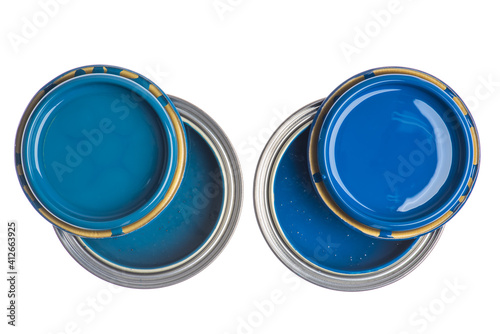 Fototapeta Naklejka Na Ścianę i Meble -  Two opened cans with blue paint top view isolated on white background