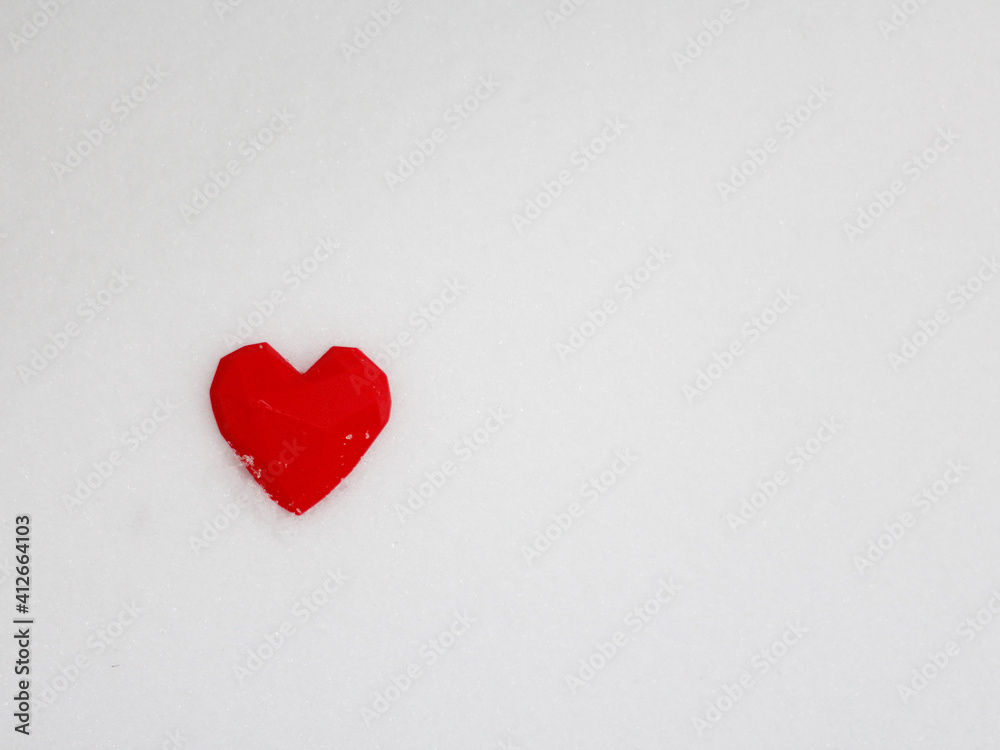 close-up of a small red heart on a white bottom. top view, place for inscription,flatlay,Valentine's Day