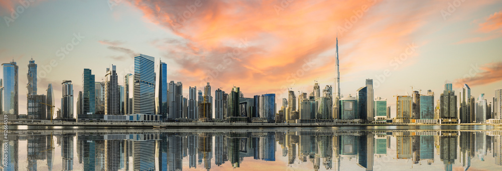 Dramatic sunset over the Dubai skyline. Dubai is the most populous city in the United Arab Emirates (UAE)