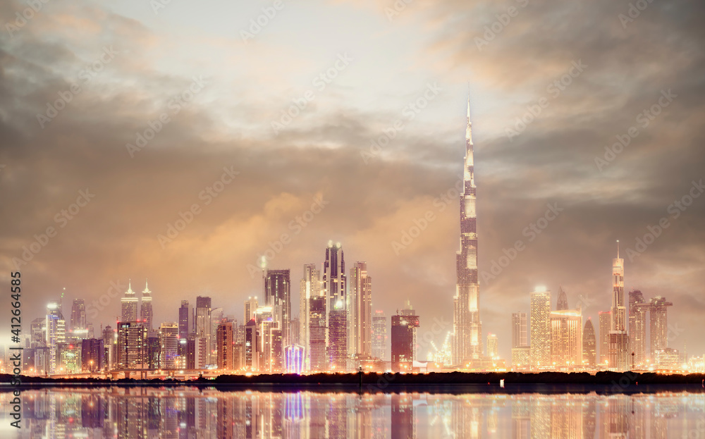 Dramatic sunset over the Dubai skyline. Dubai is the most populous city in the United Arab Emirates (UAE) 