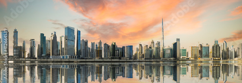 Obraz na płótnie Dramatic sunset over the Dubai skyline. Dubai is the most populous city in the United Arab Emirates (UAE) w salonie