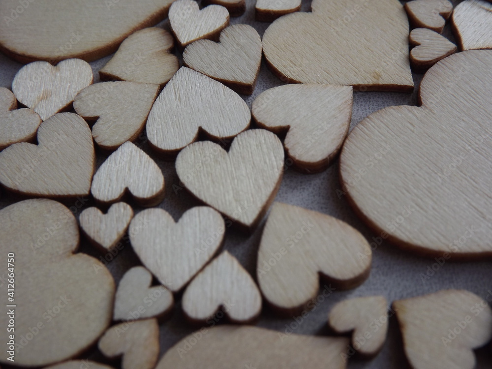 Obraz premium valentine's day greeting card-wooden hearts on a gray suede background. High quality photo