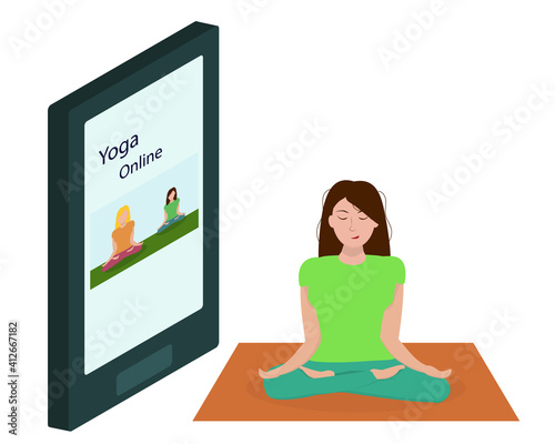 a young woman does yoga online at home. Healthy Lifestyle Concept