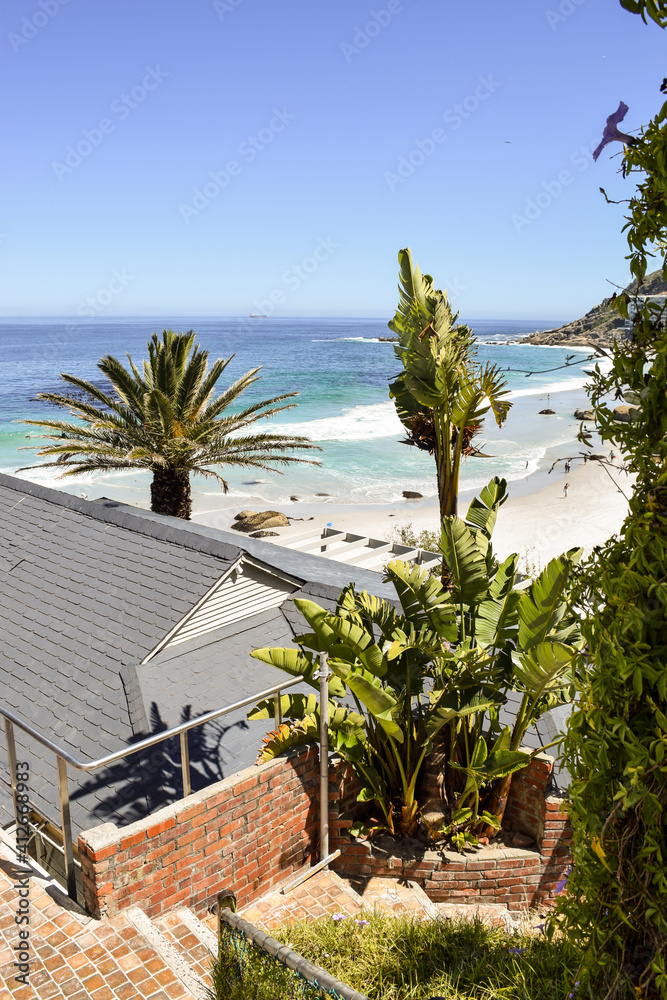 Fototapeta premium Staircase passing between the houses and leading to the sea in Clifton Beach, Cape Town, South Africa.