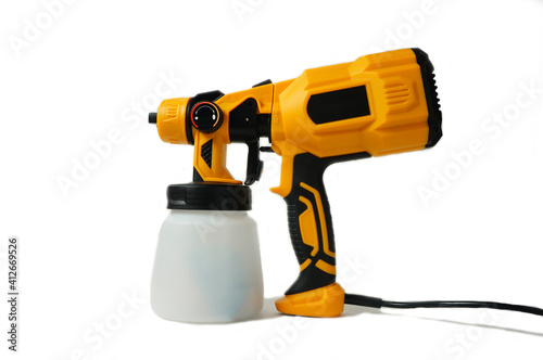 plastic professional  spray gun on dark concrete background