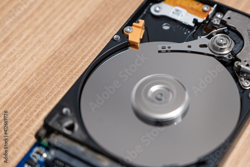 Wallpaper Mural Close up photo of the read and write head of a hard drive while it is working  Torontodigital.ca