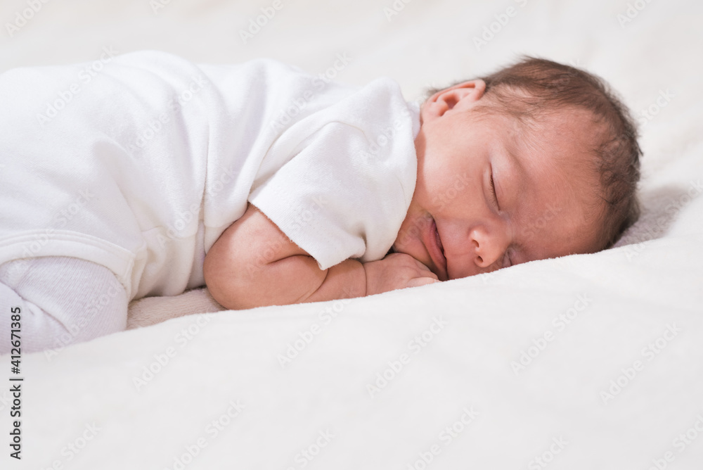 Cute, small and adorable newborn baby girl sleeping Cute, small and adorable newborn baby girl sleeping