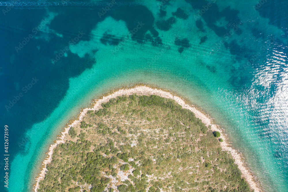 Aerial overhead drone shot of Ricul island near Galesnjak in Dalmatia Croatia