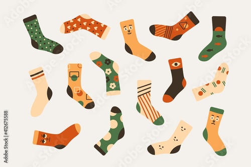 Stylish doodle socks in trendy colors with cartoon prints. A set of knitted stockings with cute design. Vector art