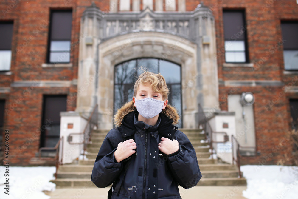 Fifth Grade Boy Child in Covid Face Mask Outside Middle School Education Building