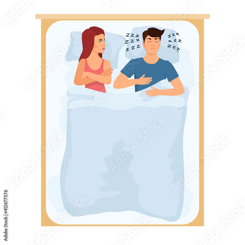 Married couple is sleeping in bed. The man snores, the wicked woman cannot sleep. View from above.