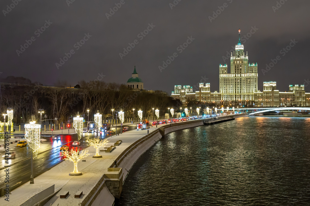 Evening Moscow. Festive capital of Russia. The Kremlin embankment is decorated with garlands for the New year. Christmas in Russia.