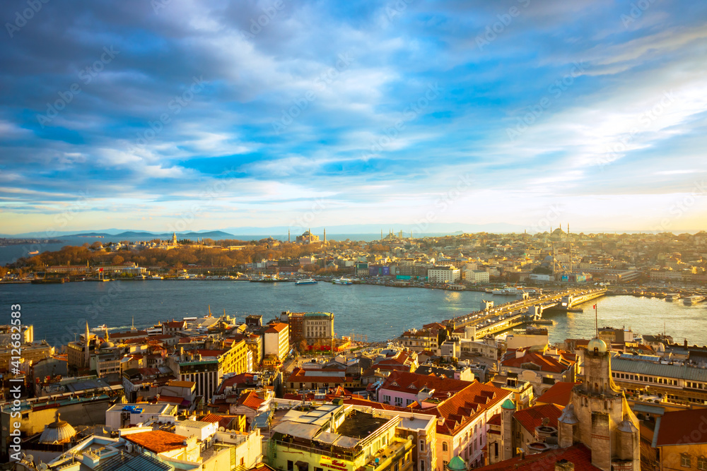 Naklejka premium Cityscape of Istanbul at sunset from Galata Tower. Istanbul background photo. Golden Horn and Historical Peninsula of Istanbul. Travel to Istanbul.