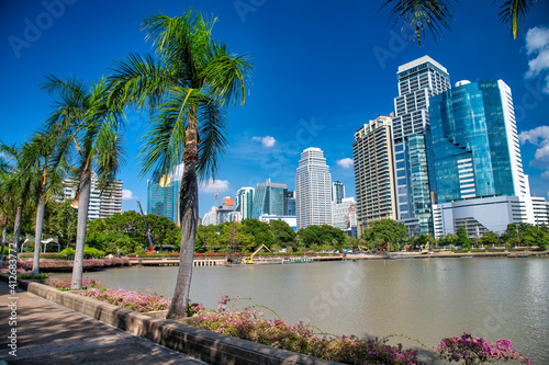 Amazing view of city skyscrapers from Bangkok Park and Lake, Thailand © jovannig