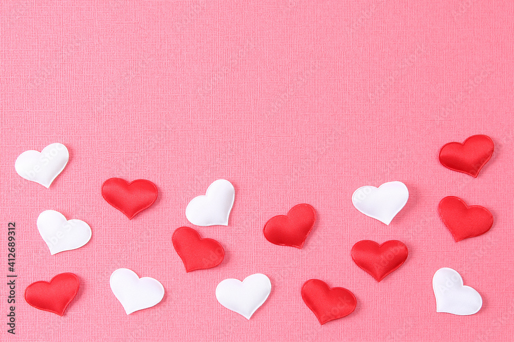 White heart and a red heart on a pink background. Concept for love day, Valentine's day, February 14th. Copy space. Valentine's Day card.