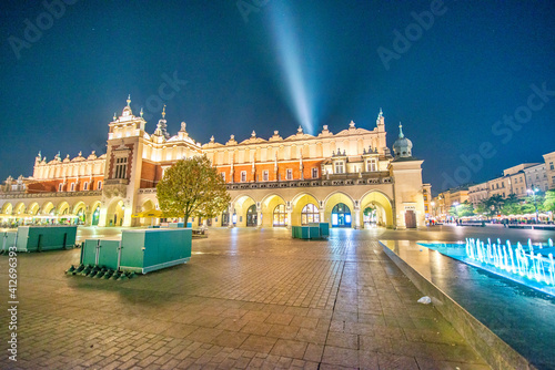 KRAKOW, POLAND - OCTOBER 1, 2017: Tourists visit the main square at night