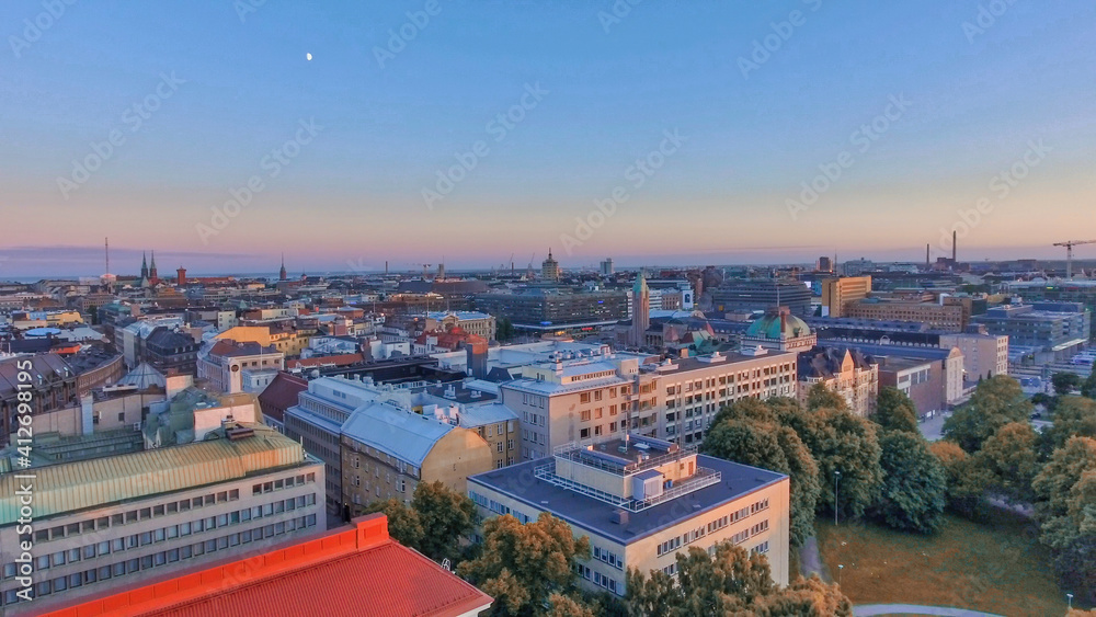 Aerial sunset view of Helsinki skyline from drone, Finland