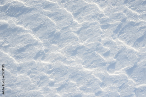 Fresh clean white snow background texture. Winter background with snowflakes and snow mounds. Snow lumps. Seasonal landscape details.