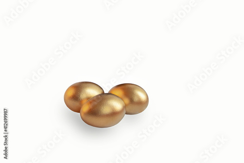 three golden easter eggs, isolate