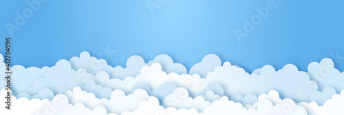 Clouds on blue sky banner. White cloud on blue sky in paper cut style. Clouds on transparent background. Vector paper clouds.White Cloud on blue sky paper cut design. Vector paper art illustration