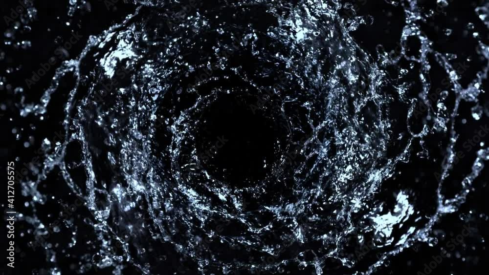Super Slow Motion Shot of Rotating Water Splash Isolated on Black Background at 1000fps.