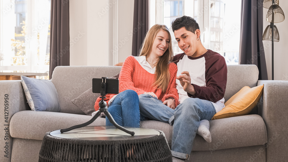 Young bloggers creating content for social media while making a video at home. Young bloggers creating content for social media while making a video at home.