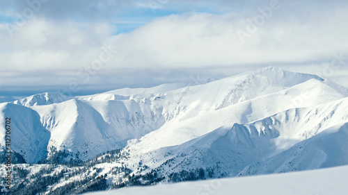 Mountain peaks covered in snow on sunny winter day. High quality photo