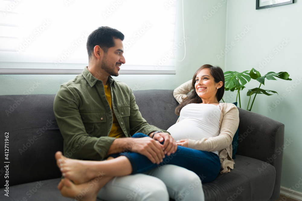 Happy pregnant wife and husband sharing happy thoughts Happy pregnant wife and husband sharing happy thoughts