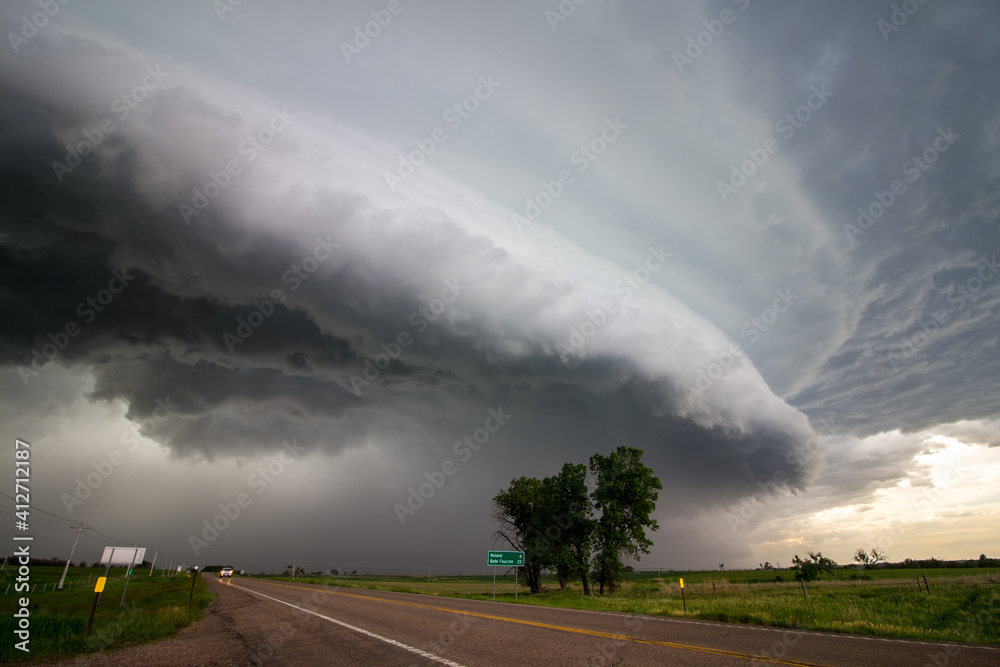 A shelf cloud approaches over a highway in the plains preceding a derecho. A shelf cloud approaches over a highway in the plains preceding a derecho.