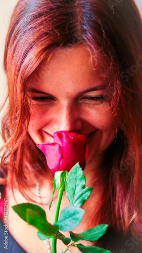 Foto Brazilian shy girl with a red rose