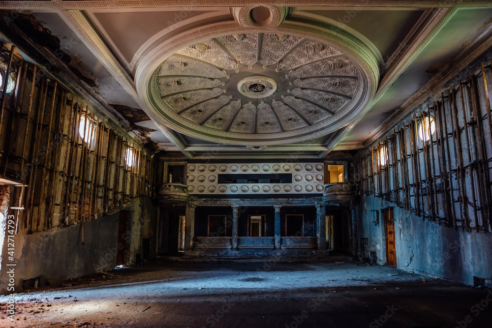 Old creepy abandoned ruined empty theater hall
