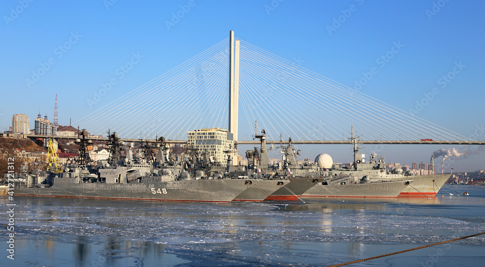 Water area with warships of the seaside city in winter