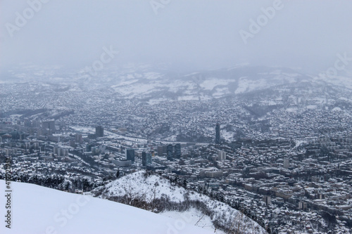 Beautiful view of Sarajevo in winter. Sarajevo under the snow. View of snowy Sarajevo from the mountain Trebevic. photo