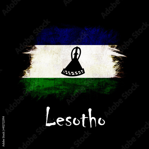 National flag of Lesotho, abbreviated with ls; a realistic 3d image of the national symbol from an independent country painted on a black background with the countryname below photo