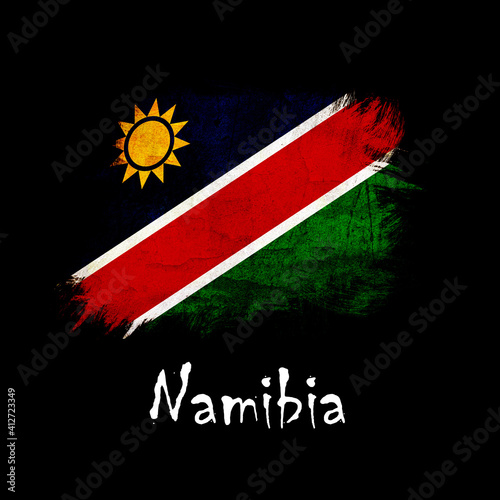 National flag of Namibia, abbreviated with na; a realistic 3d image of the national symbol from an independent country painted on a black background with the countryname below photo