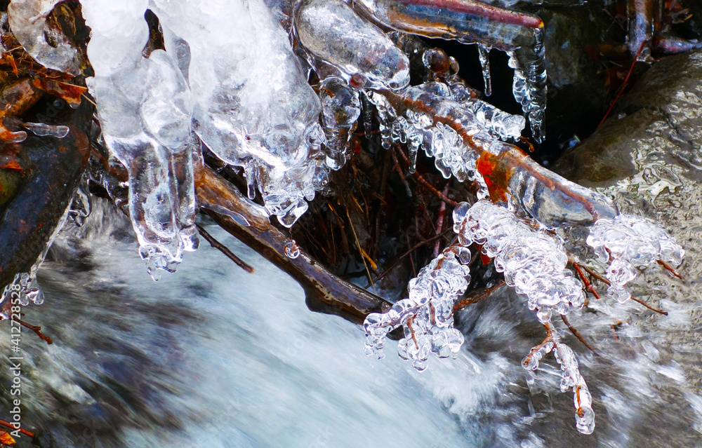 Beautiful icicles on a frozen mountain stream Beautiful icicles on a frozen mountain stream
