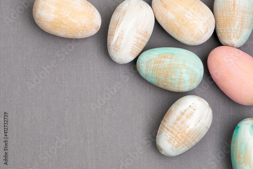 Wooden Easter eggs pastel colors with copy space photo