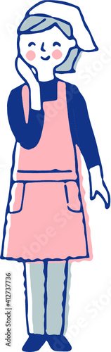 エプロン姿の笑顔の女性