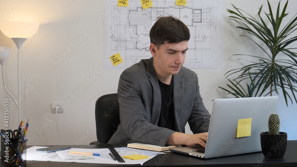 A businessman works from his home office during a pandemic. Engineer architect. A businessman works from his home office during a pandemic. Engineer architect.