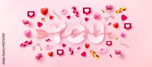 Love You Card or Banner with symbol of arrow love script over you word and valentine elements on pink background.Promotion and shopping template for love and Valentine's day in flat lay style. photo