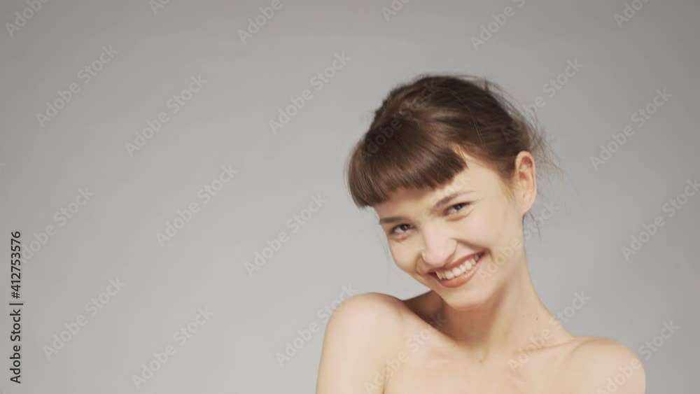 Video portrait of a cute girl in studio, making sad and happy facial expressions. Video portrait of a cute girl in studio, making sad and happy facial expressions.