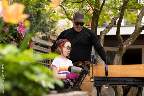 Father and daughter doing home improvement