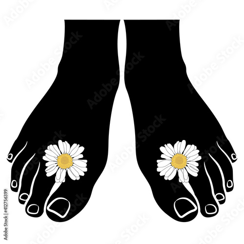 Two bare human feet adorned with chamomile or daisy flowers. Creative funny concept for summer time and happy leisure.