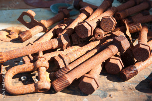 Pile of old rusty nuts and bolts
