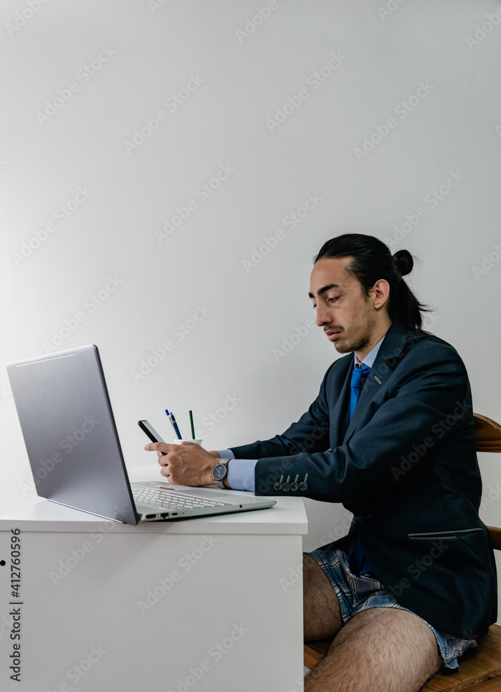 young, long-haired businessmen on his cell phone young, long-haired businessmen on his cell phone